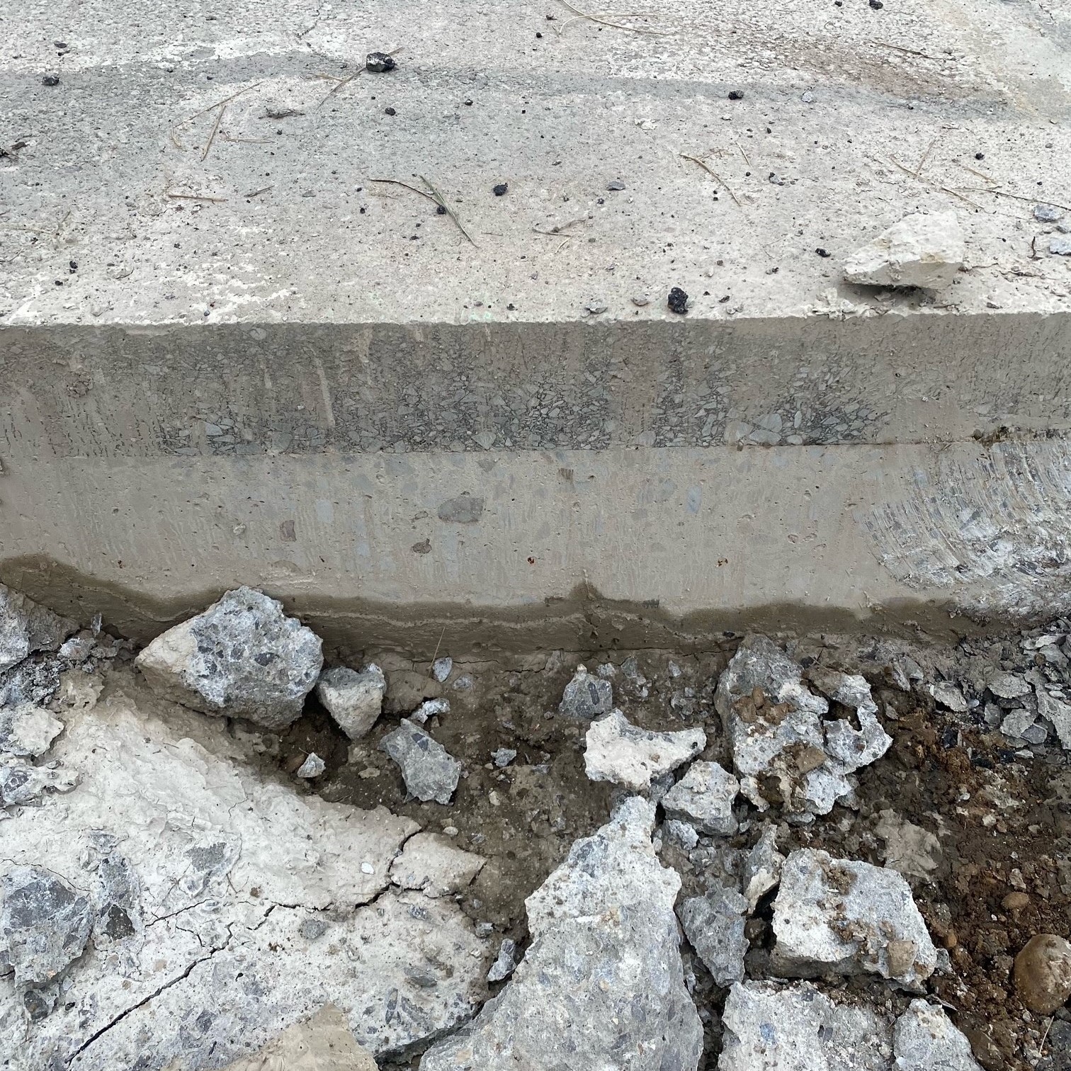 An image showing a close up look of the thin-bonded concrete overlay on an existing pavement